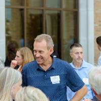 Guests outside talking with one another.